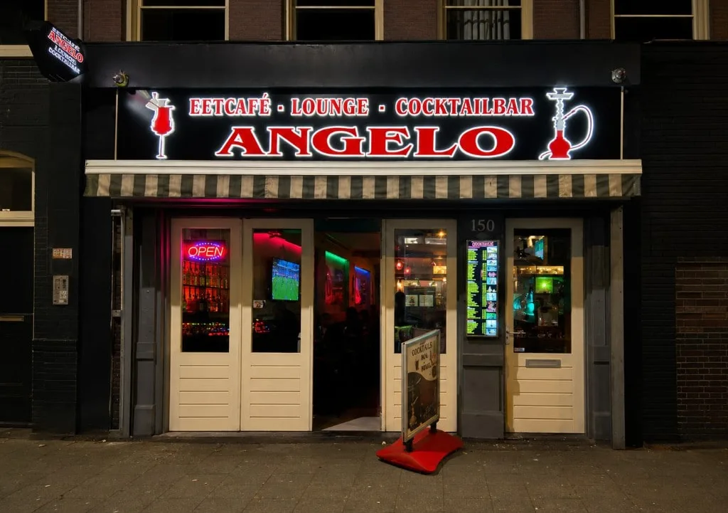 Angelo Eetcafé Lounge and Cocktailbar storefront at night in De Pijp, Amsterdam
